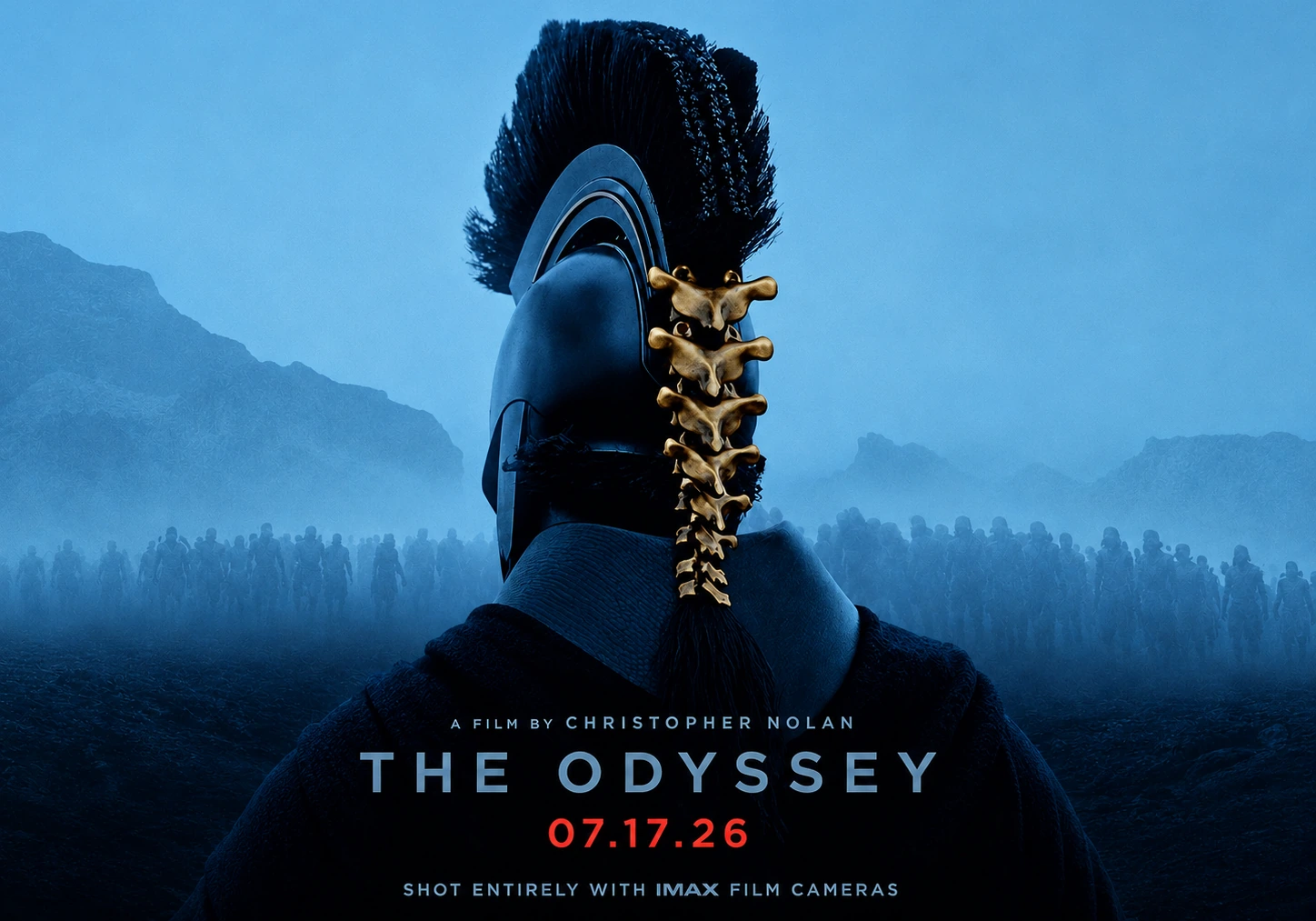 Promotional artwork for The Odyssey showing the back of a helmeted warrior. The full composition includes the film title, release date, and a line stating it was shot entirely with IMAX film cameras.
